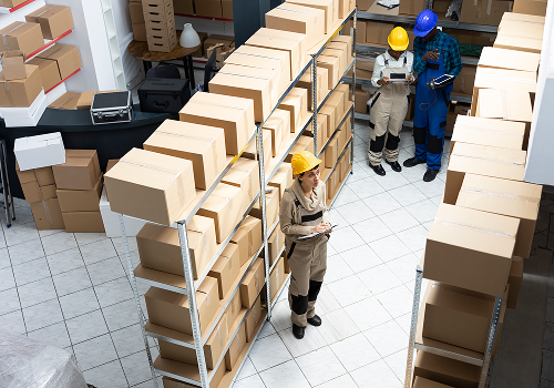 diverse-employees-group-preparing-parcels-managing-stock-organized-warehouse-depot